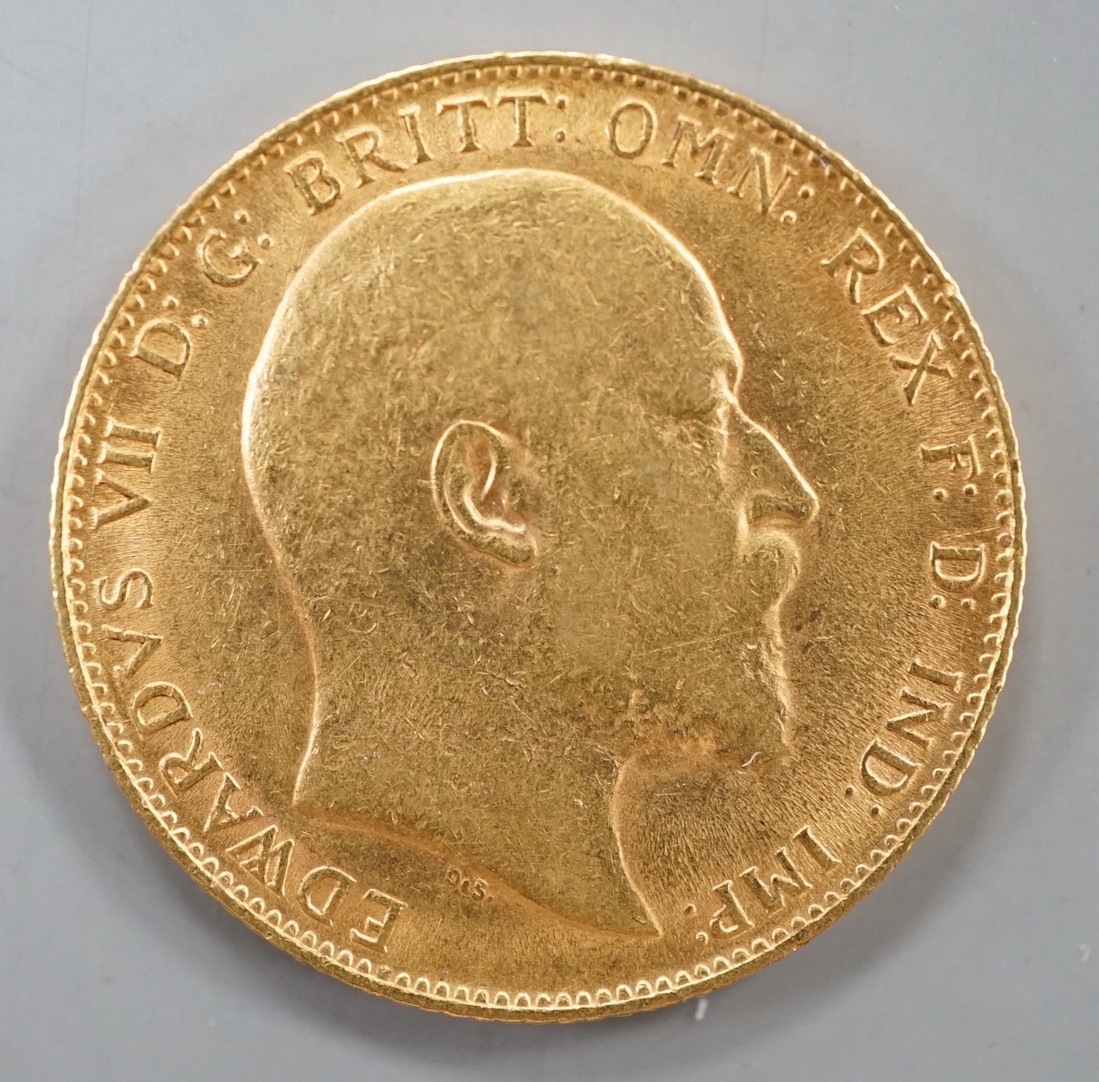 An Edward VII 1909 gold sovereign.